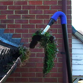 A The Exterior Group technician using a gutter inspection camera to see the highest places.